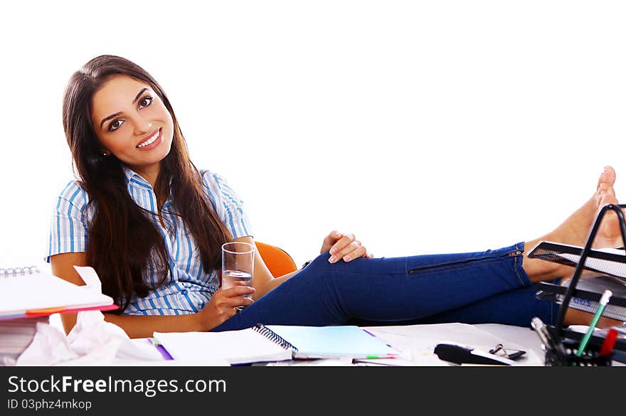 Young and beautiful student girl at the desk