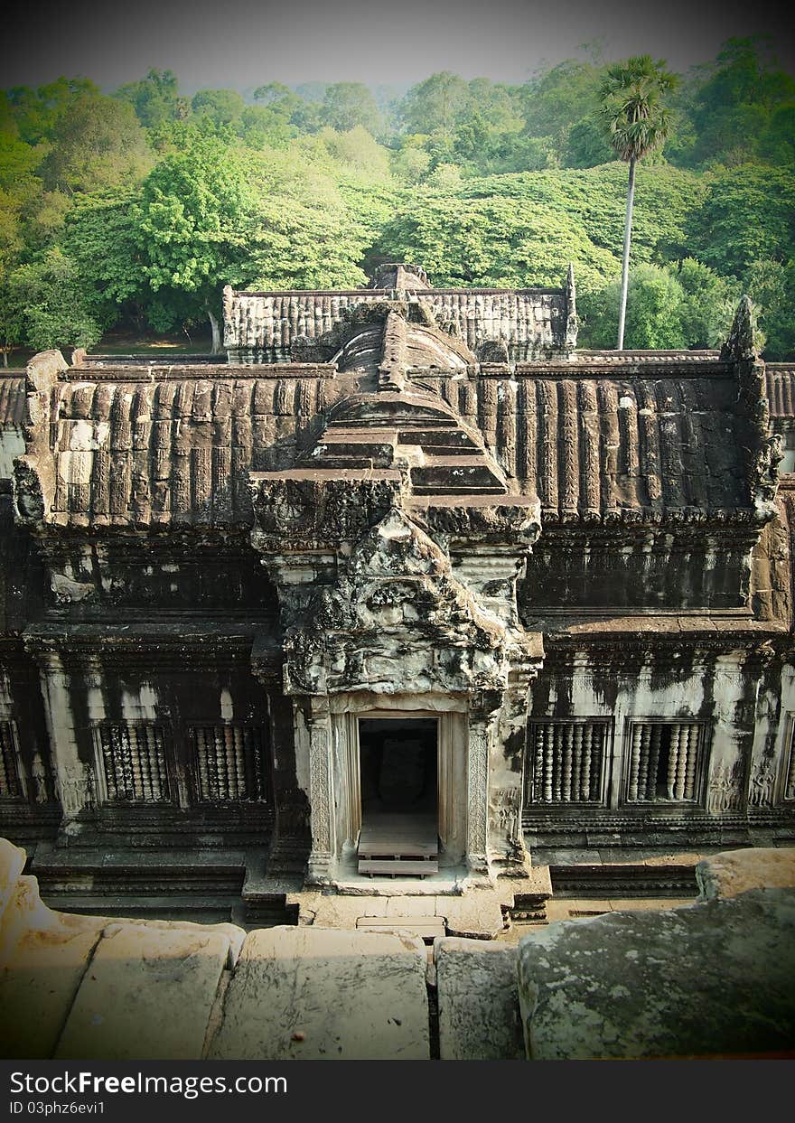 This Gate, which has no stairway, was used by the king and others for mounting and dismounting elephants directly from the gallery. North of the gate is a Khmer inscription recording the erection of a nearby stupa in the 18th Century. This Gate, which has no stairway, was used by the king and others for mounting and dismounting elephants directly from the gallery. North of the gate is a Khmer inscription recording the erection of a nearby stupa in the 18th Century.