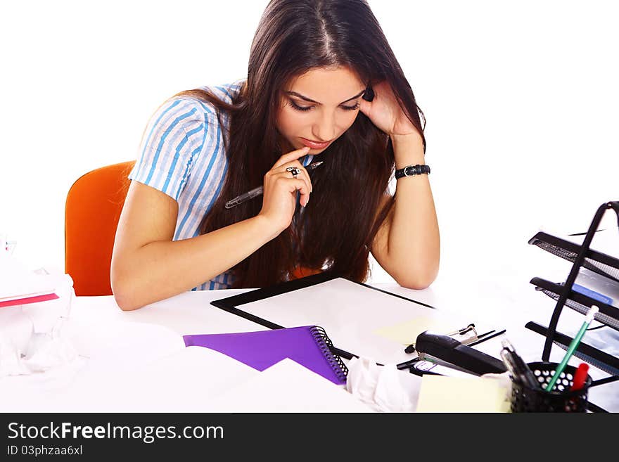 Young and beautiful student girl at the desk