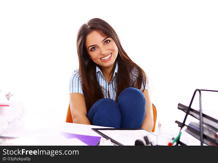 Young and beautiful student girl at the desk