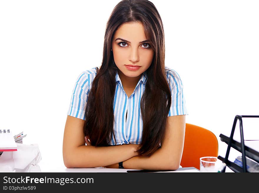 Young and beautiful student girl at the desk