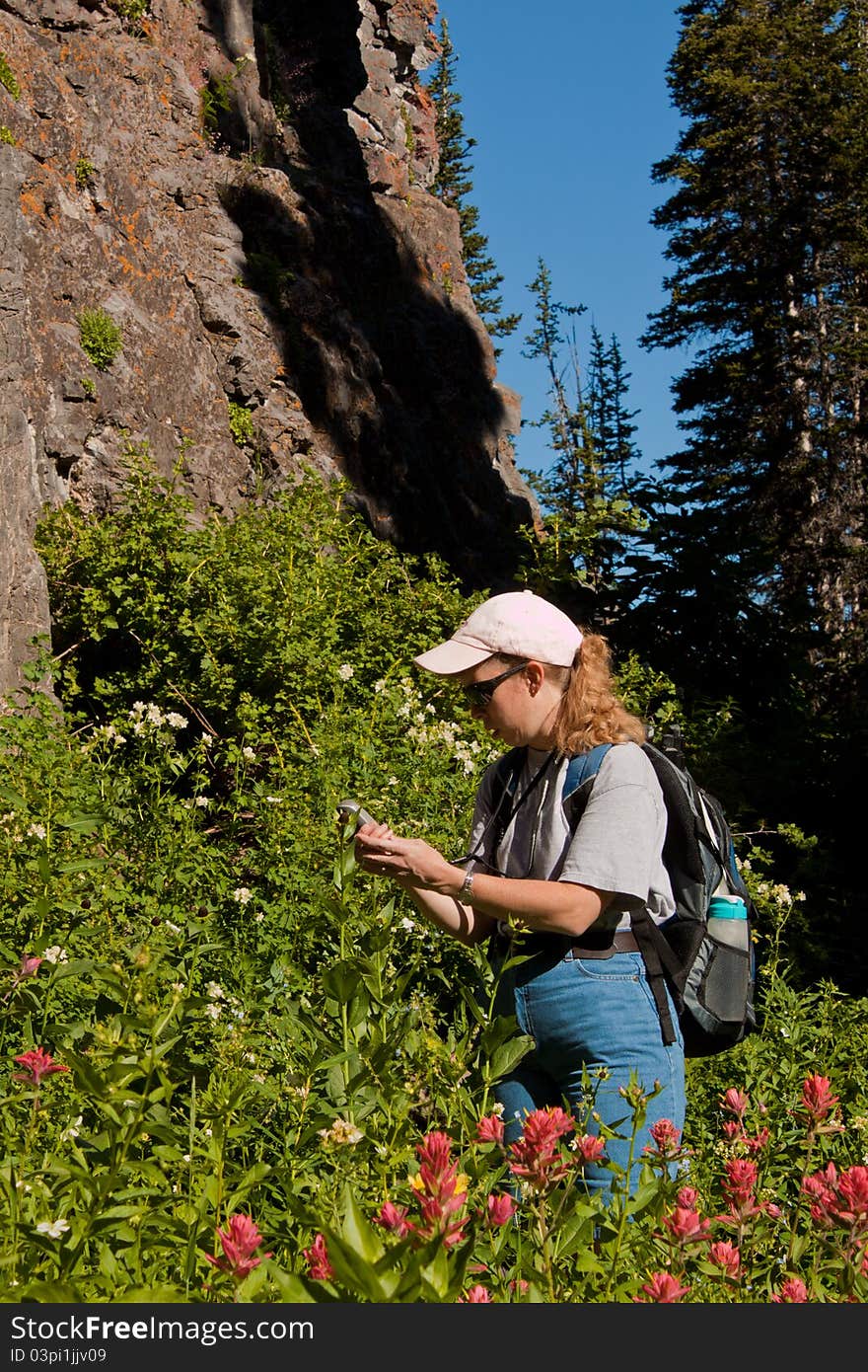 Woman searching for a geocache