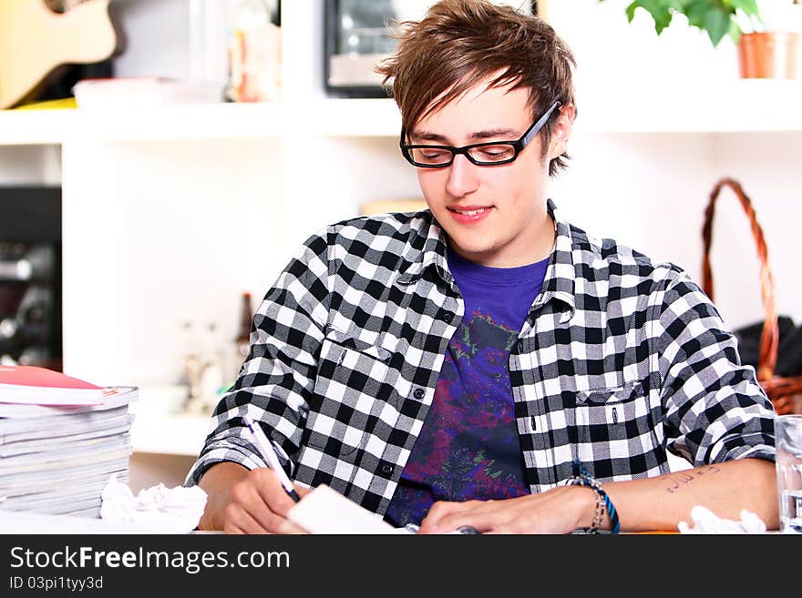 Young Student Studying At Home