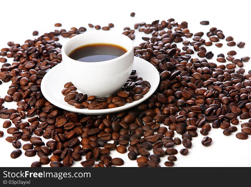 Coffee beans with white cups on the table