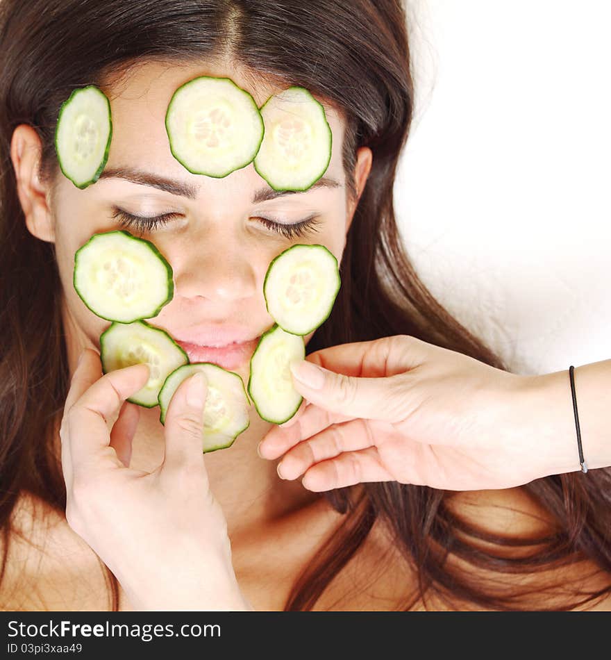 Cucumbers circles on a girl face. Cucumbers circles on a girl face