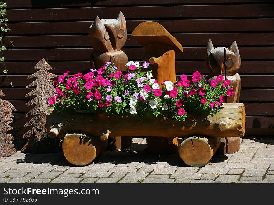 Trees,owl and a flower box made of wood. Trees,owl and a flower box made of wood