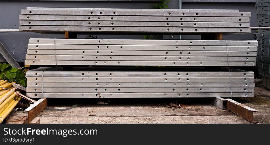 Pile of matal girder in group onfloor in stockpile. Pile of matal girder in group onfloor in stockpile