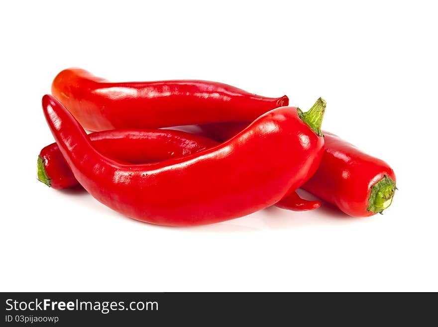 Fresh red hot pepper on a white background. Fresh red hot pepper on a white background