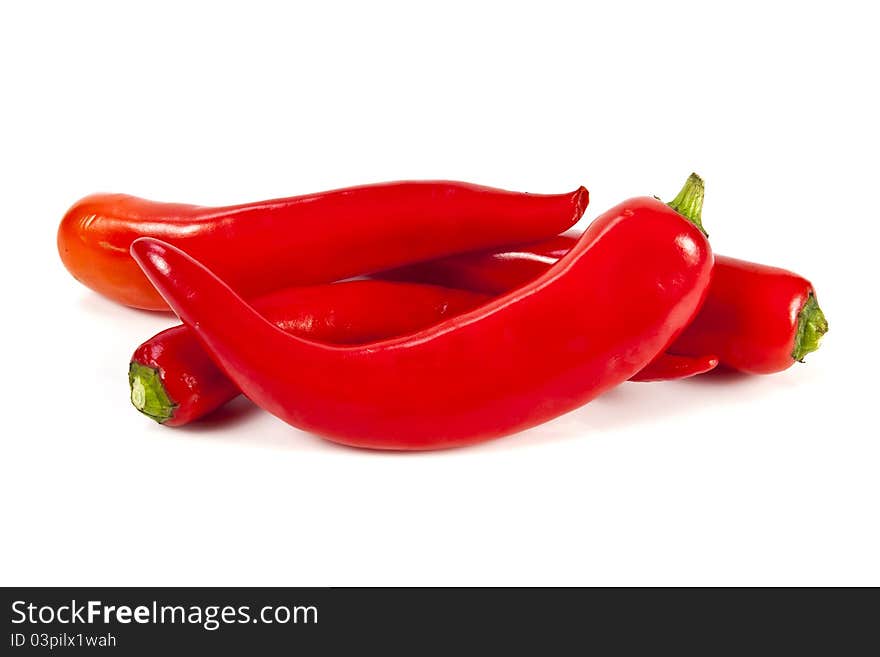 Fresh red hot pepper on a white background. Fresh red hot pepper on a white background