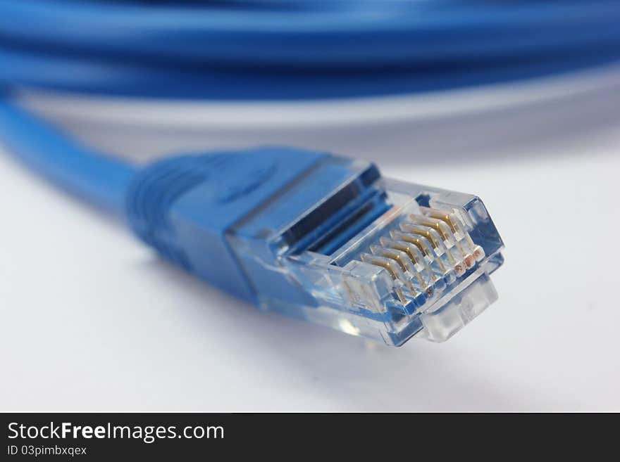 Blue computer cable from white background. Blue computer cable from white background