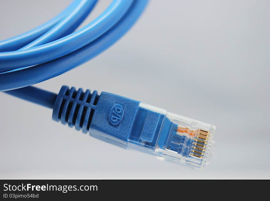 Blue computer cable from white background. Blue computer cable from white background