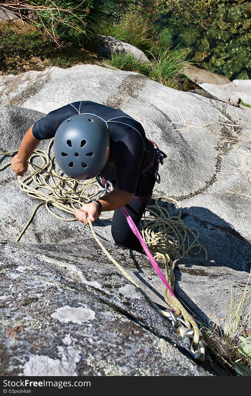 Men preparing to rappel on waterfall. Men preparing to rappel on waterfall