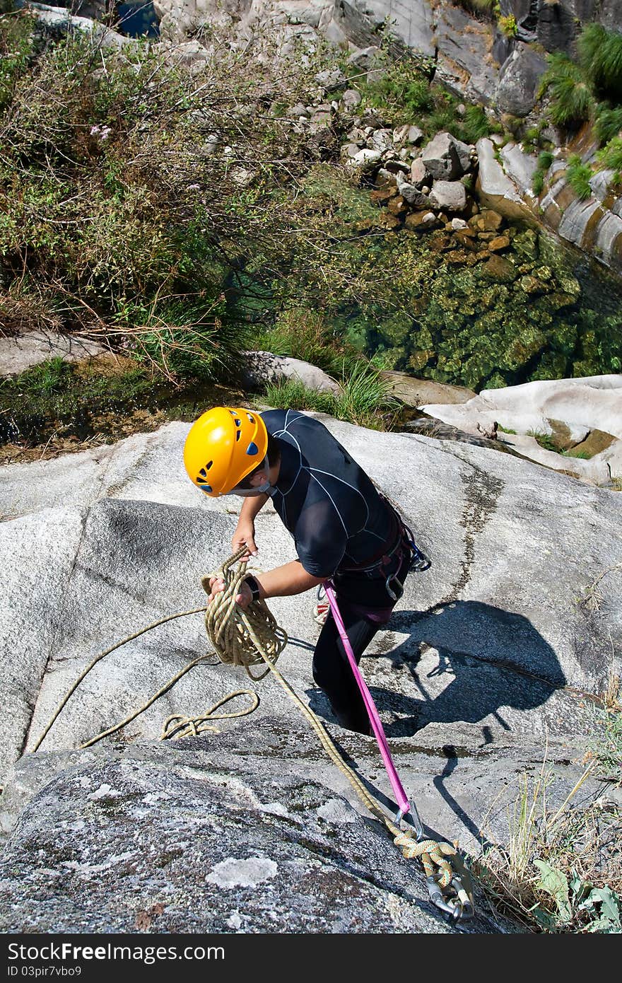 Men prepering to rappel on waterfall. Men prepering to rappel on waterfall