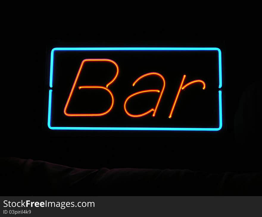 Red neon sign bar, with blue neon frame on a black background. Red neon sign bar, with blue neon frame on a black background