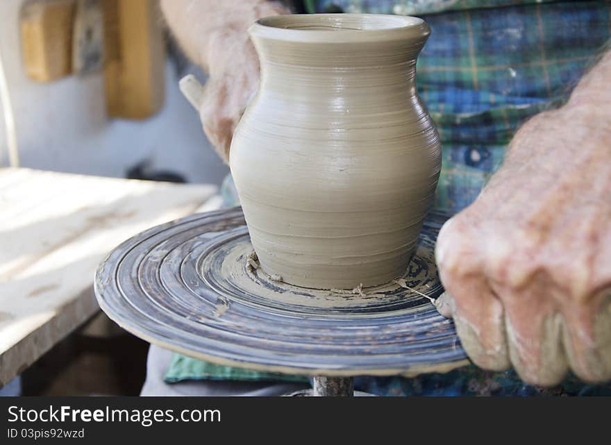 The creation of pottery on wheel