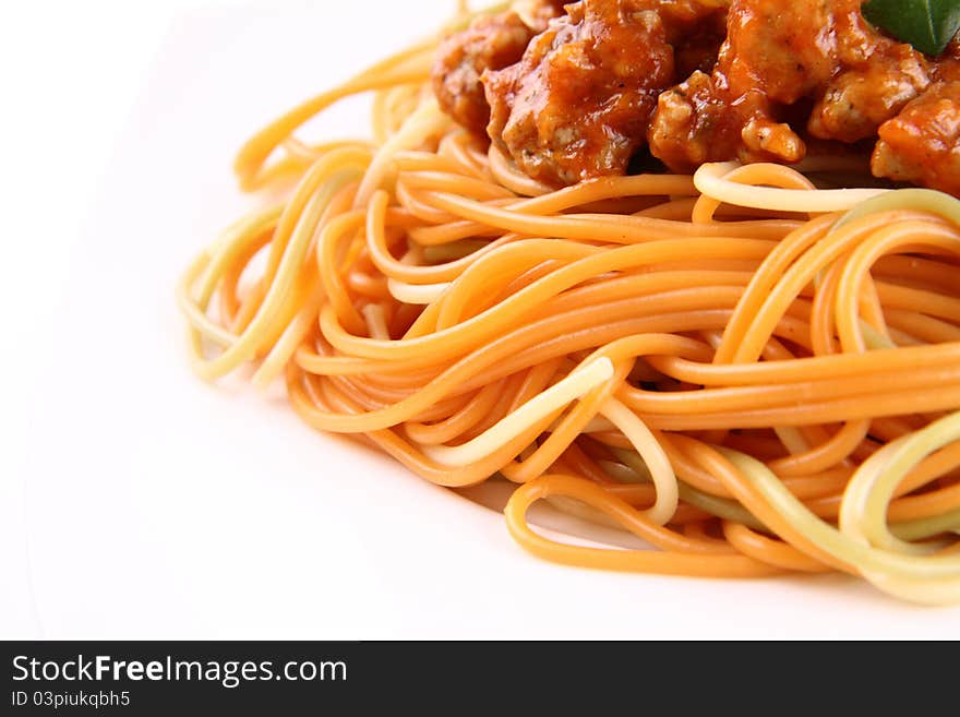 Colorful Spaghetti bolognese on a plate in close up