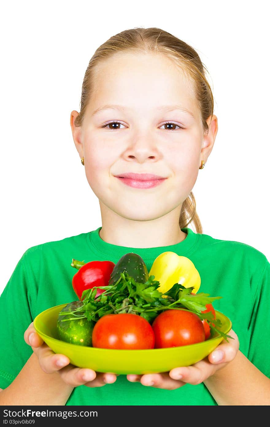 Little girl with vegetables isolated on white