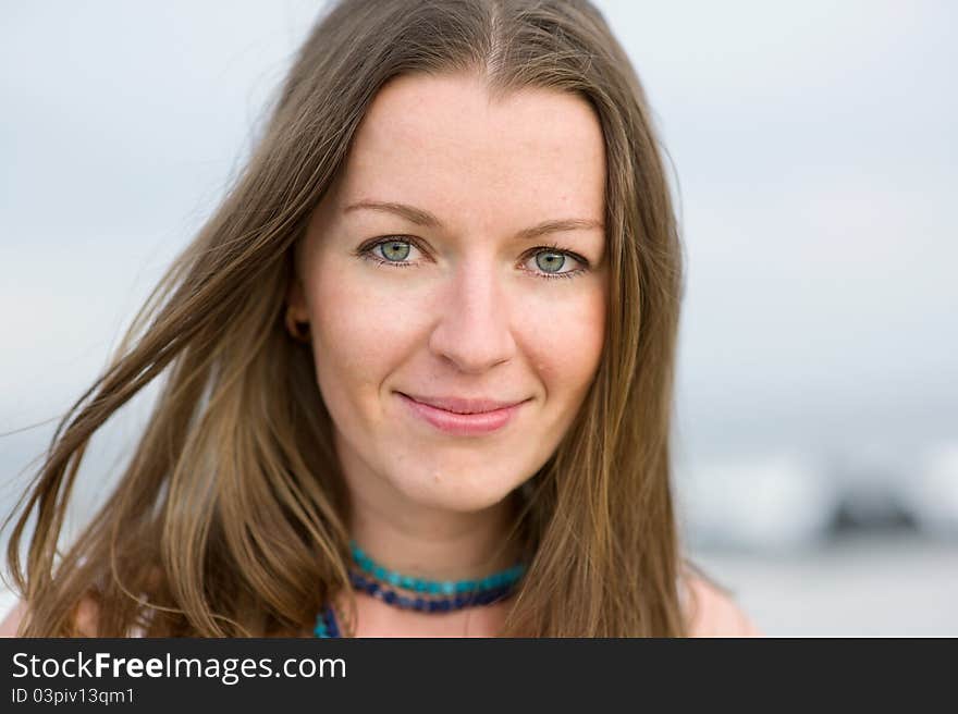 Portrait of a beautiful brunette woman with a necklace. Portrait of a beautiful brunette woman with a necklace