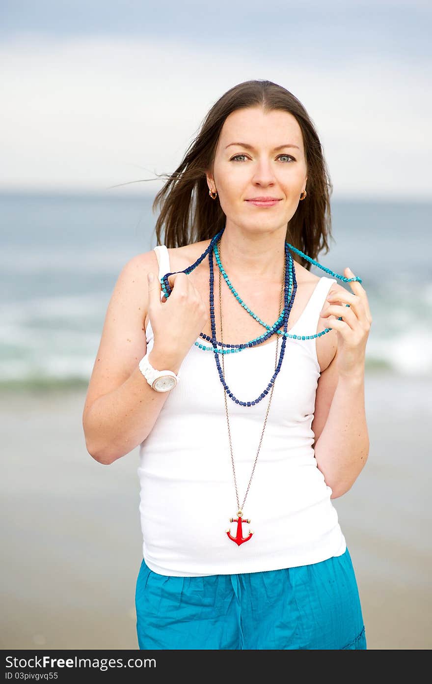 Portrait of a beautiful brunette woman with a necklace. Portrait of a beautiful brunette woman with a necklace