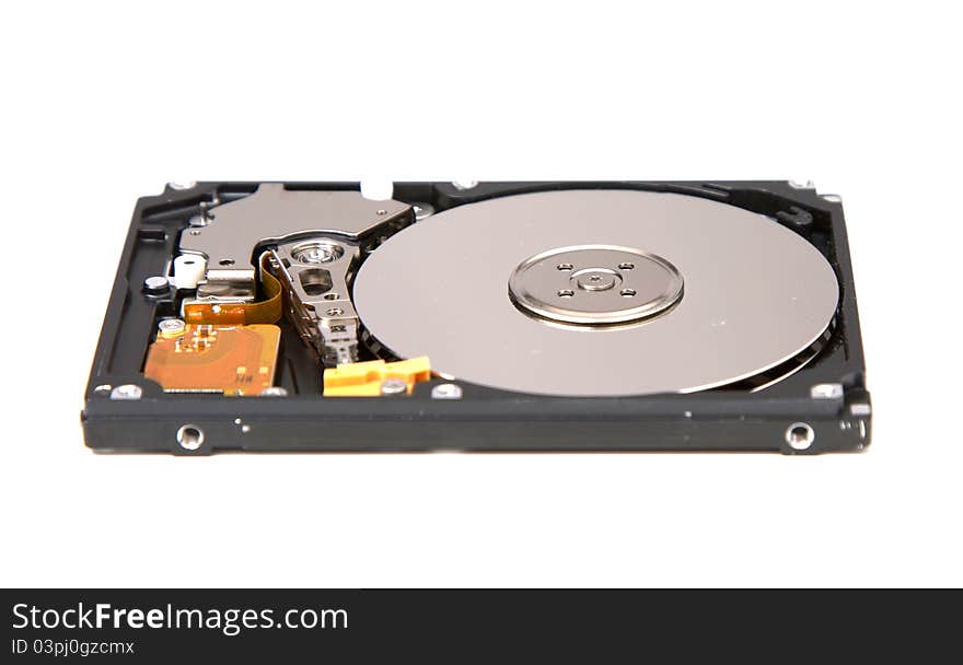 Inside of a SATA hard drive from a laptop. Inside of a SATA hard drive from a laptop