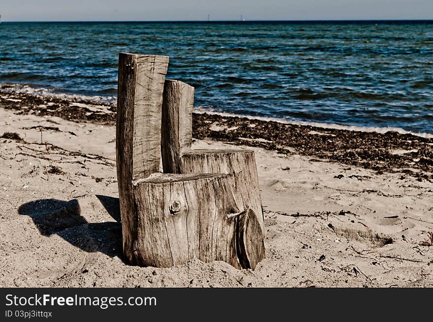 Two homemade chairs placed on beach. Two homemade chairs placed on beach