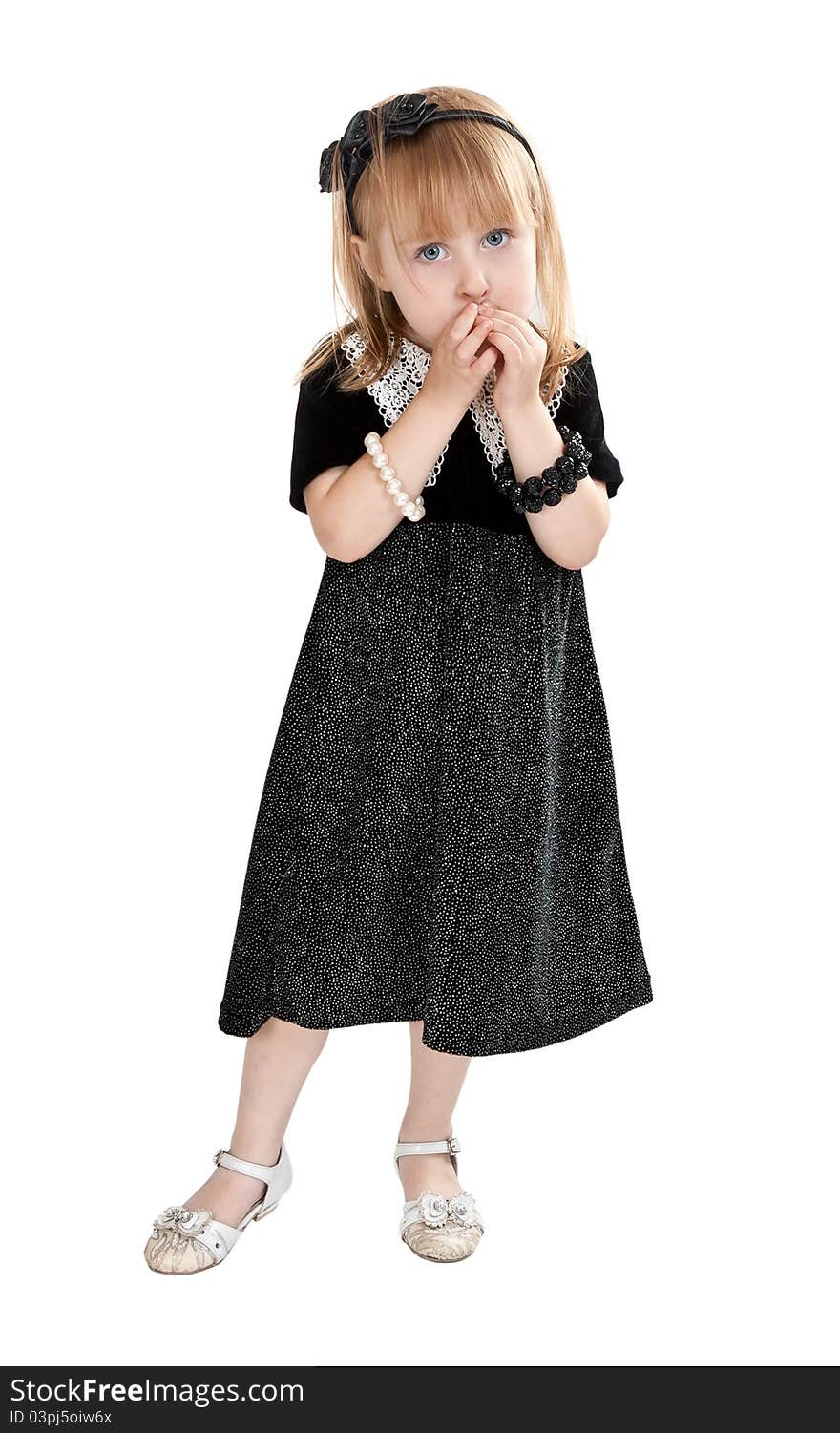 Little girl in a dress on a white background