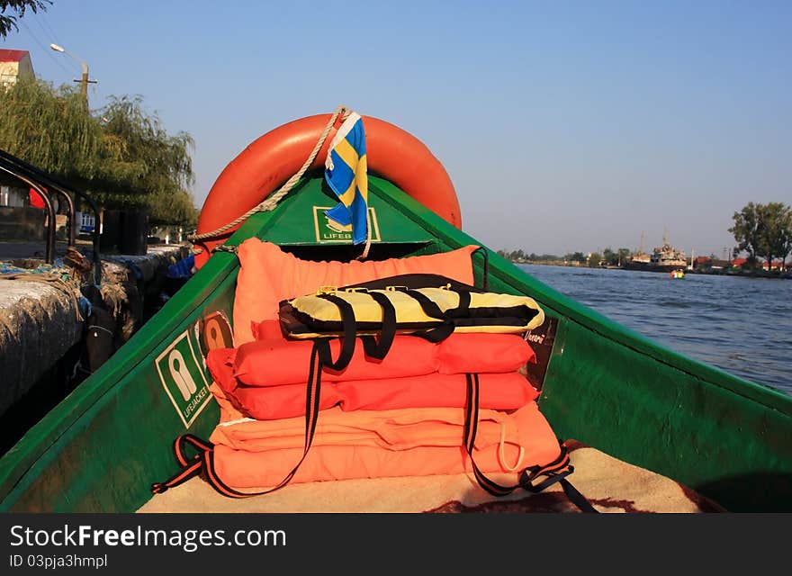 Stock Of Lifebuoys On A Boat On The River