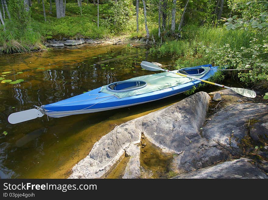 Canoe on shore of lake in Wilderness