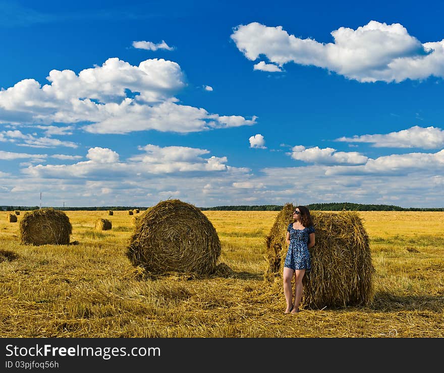 Stacks of collected wheat. The big yellow field after harvesting