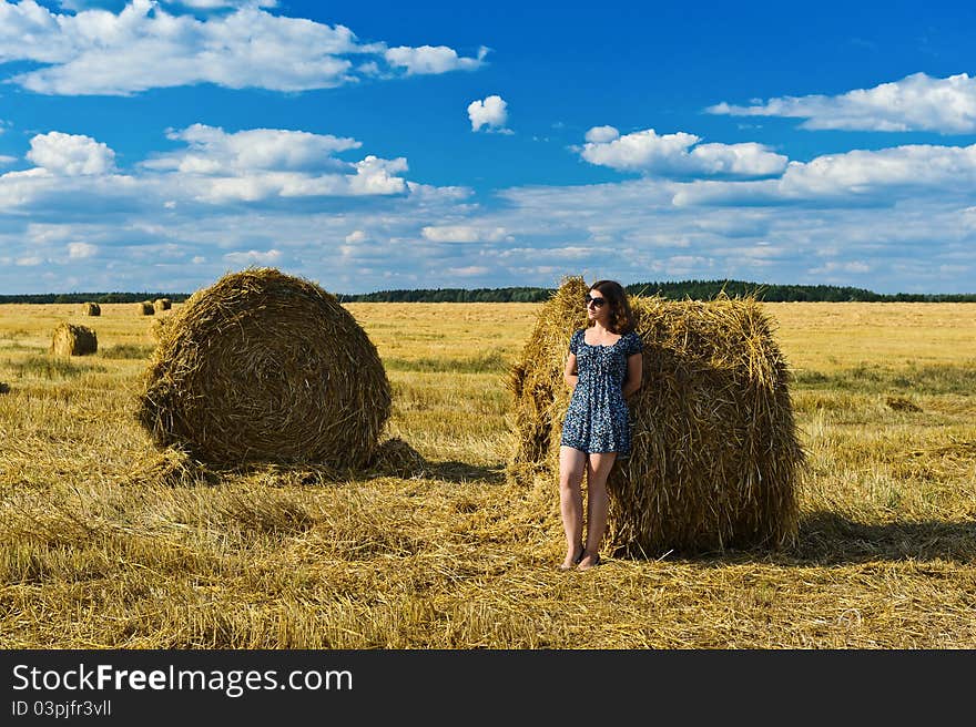 Stacks of collected wheat. The big yellow field after harvesting