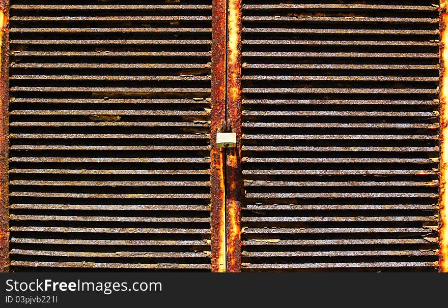 Texture of a rusty metal door