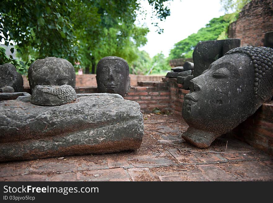 A beautifully carved Buddha statue head in Ayutthaya, Thailand. A beautifully carved Buddha statue head in Ayutthaya, Thailand