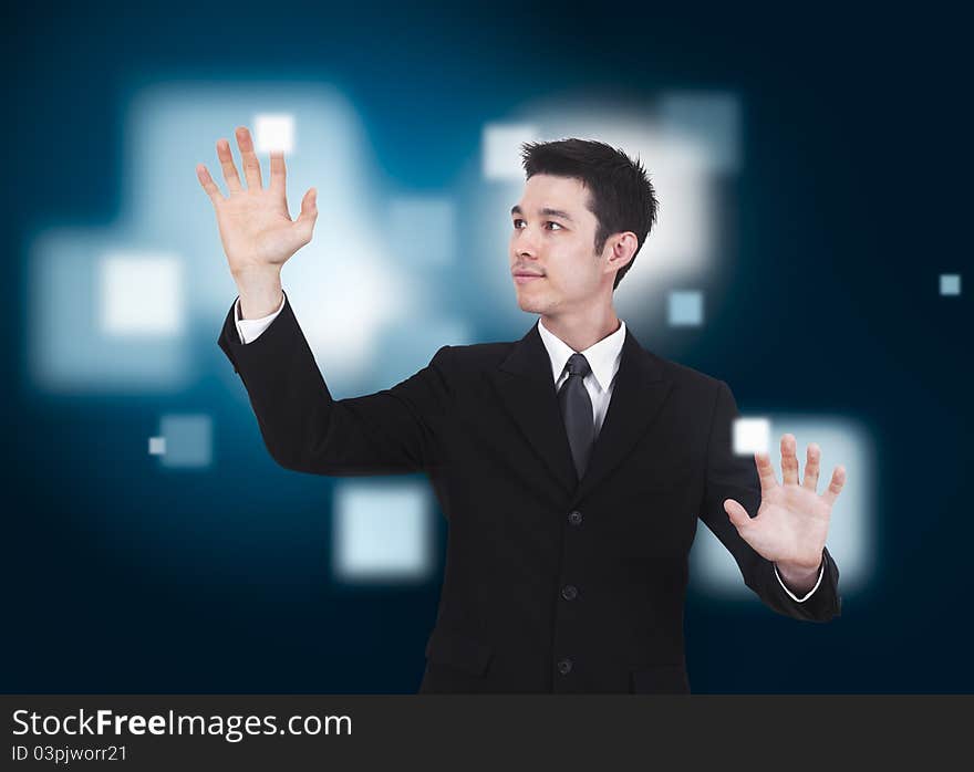 Business man pressing a touchscreen button