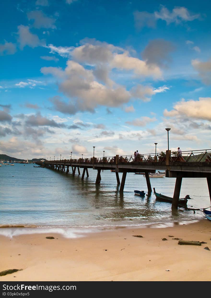 Beach sea cloudy and pier. Beach sea cloudy and pier