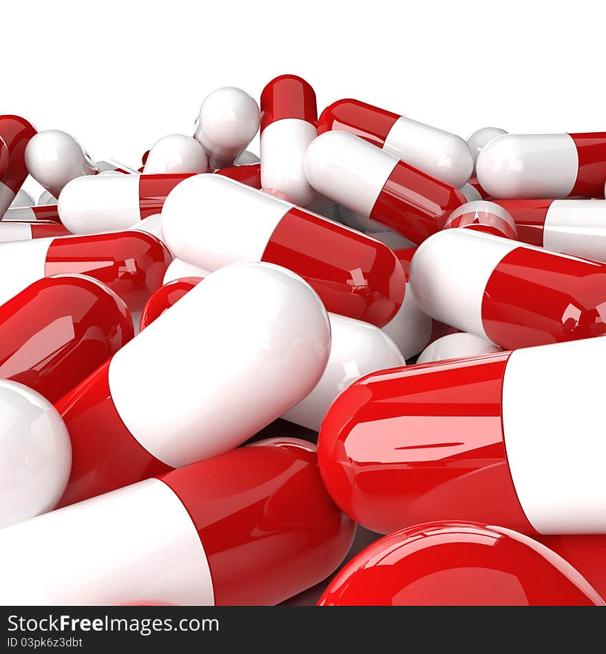 Heap of red-white capsules on a white background