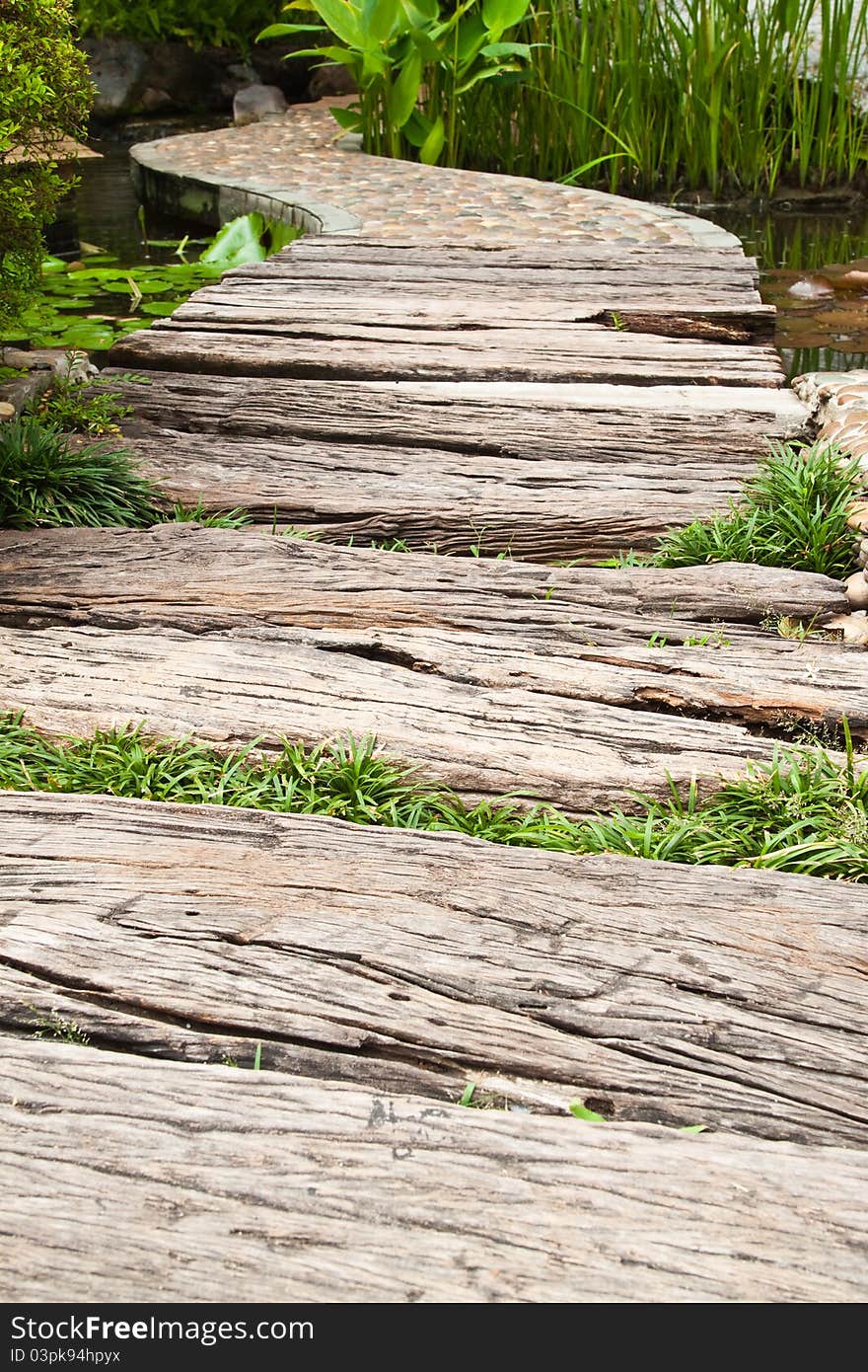 Walkway cross the pond in the garden