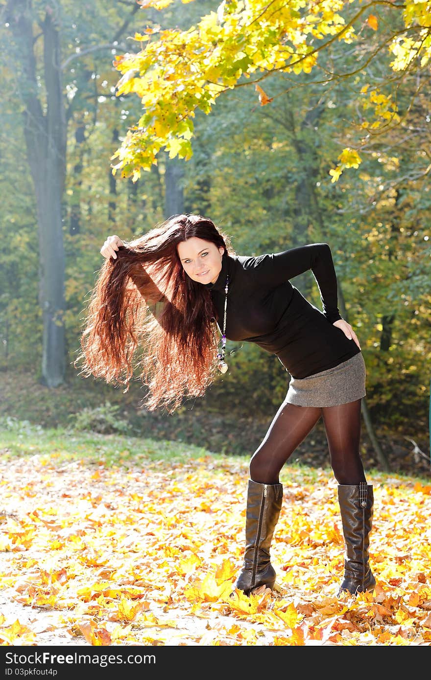 Young woman in autumnal nature