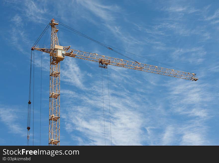 Сonstruction crane on blue sky background. Сonstruction crane on blue sky background