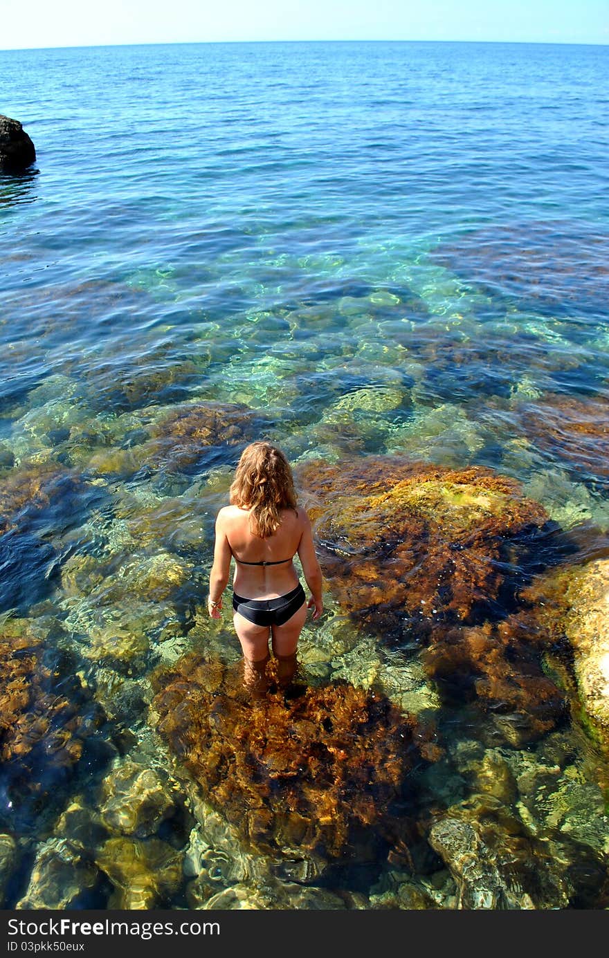 Happy beautiful girl in the sea. Happy beautiful girl in the sea