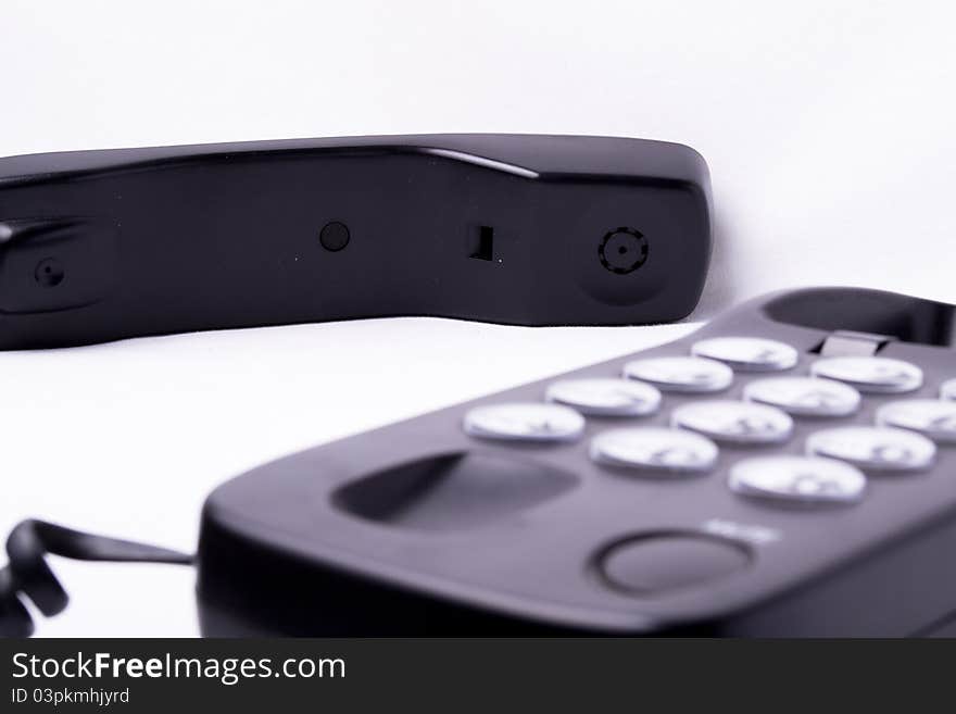 Black modern telephone iwth whit background