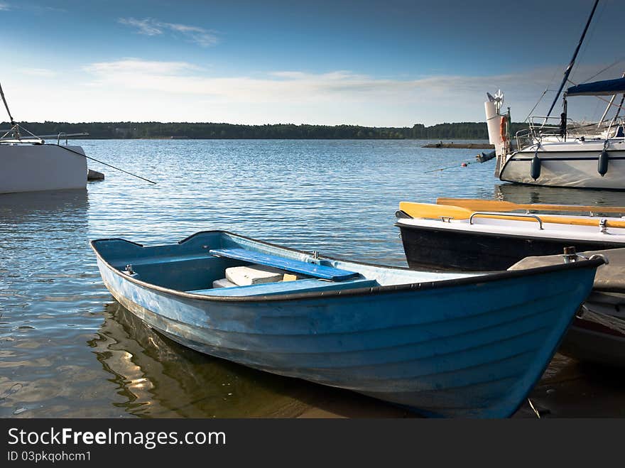 Yachts on an anchor in harbor, boats series