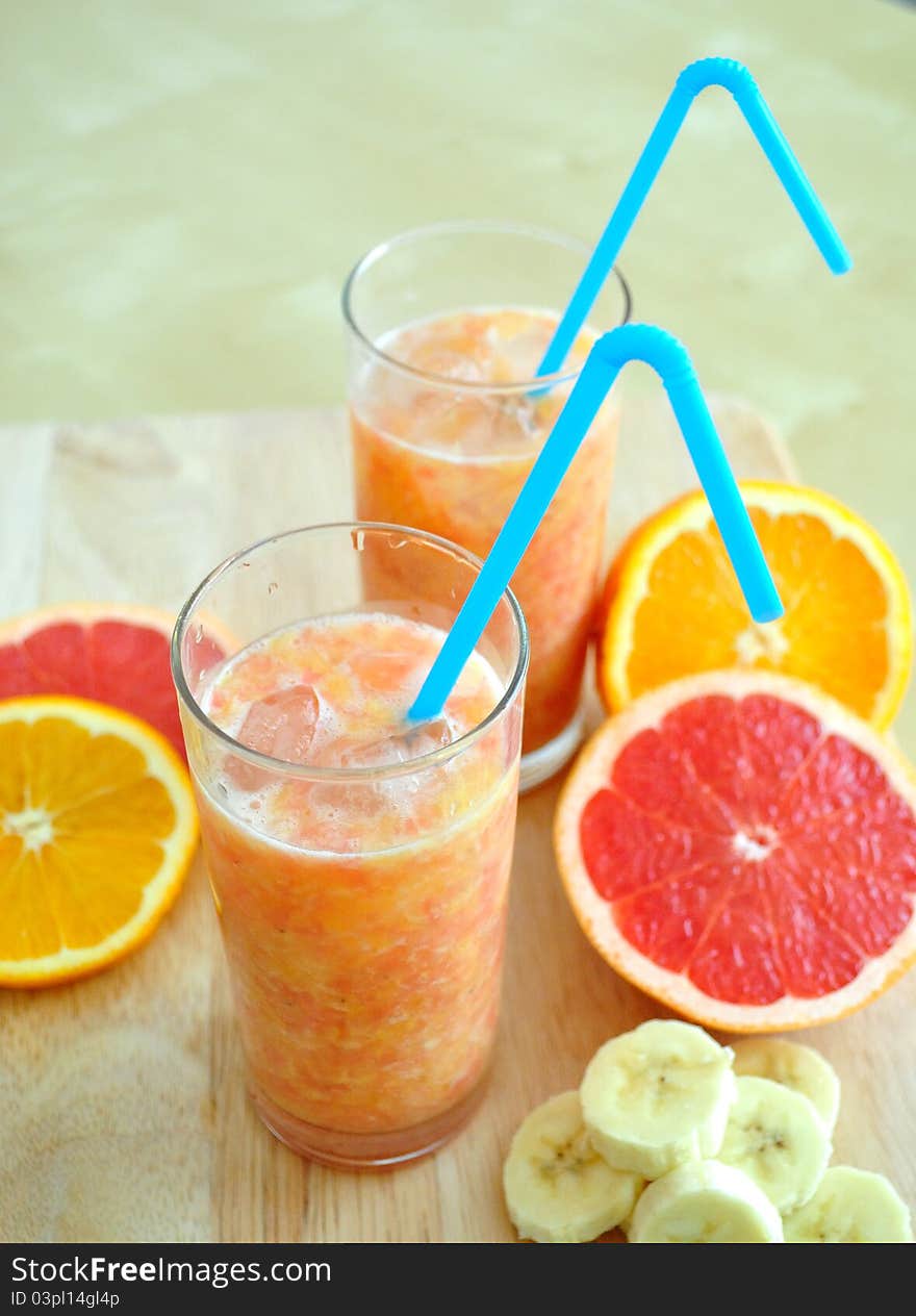 Orange, grapefruit and bananas smoothie for hot summer days. Orange, grapefruit and bananas smoothie for hot summer days