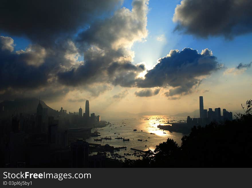 Two finance tower on the sea with cloudy sky. Two finance tower on the sea with cloudy sky