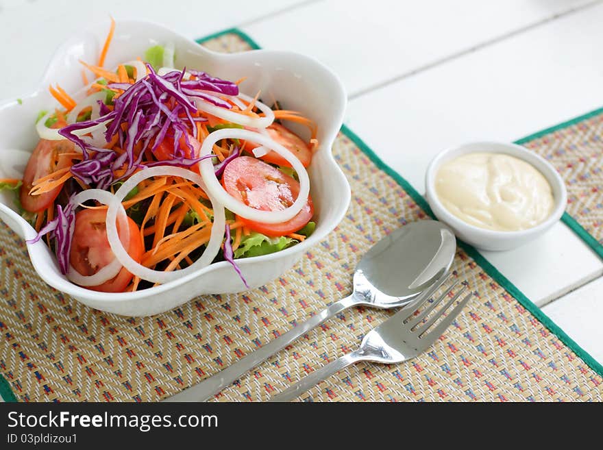 Fresh vegetable salad on the mat