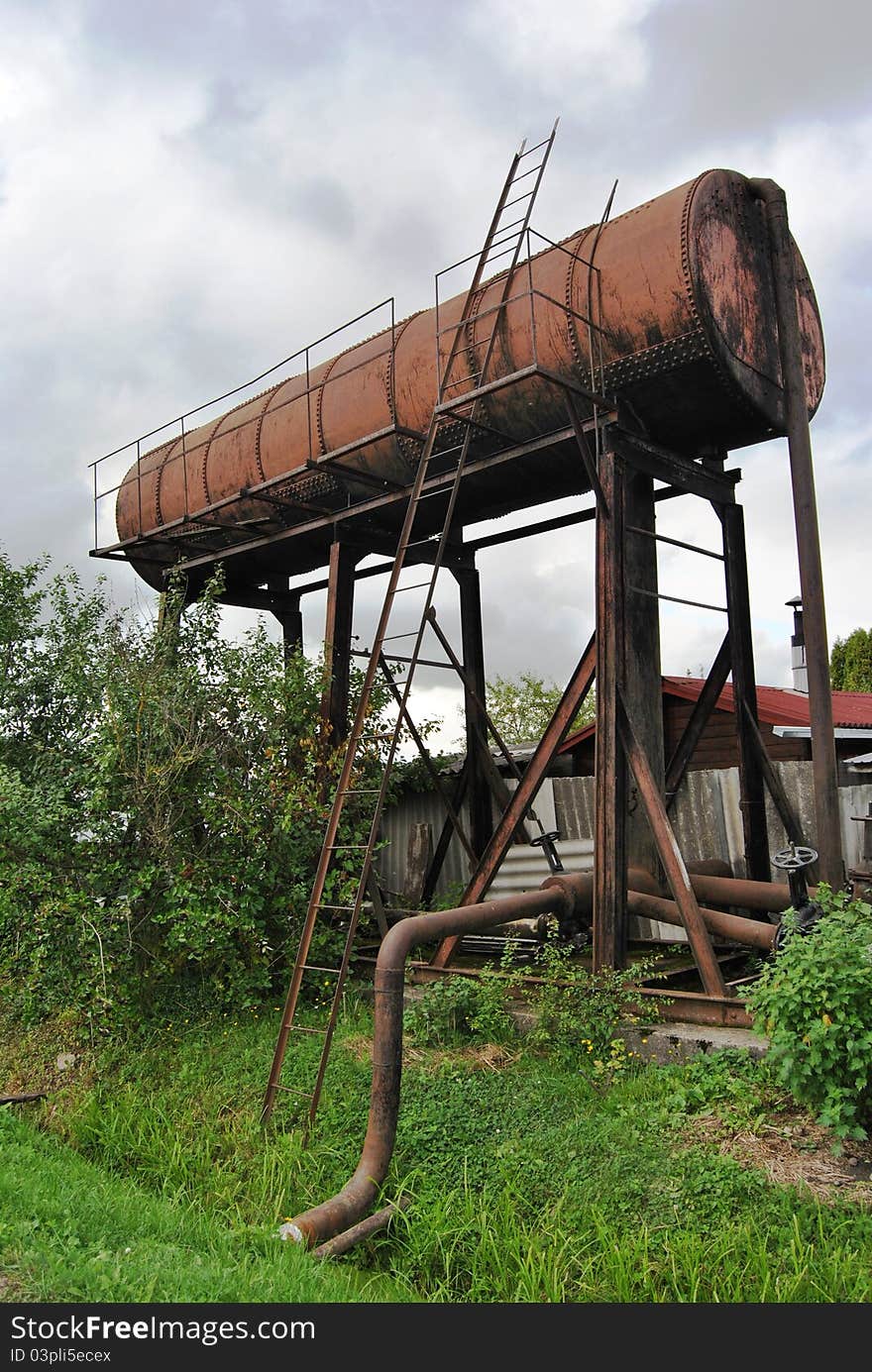 Old rusty water tank in garden