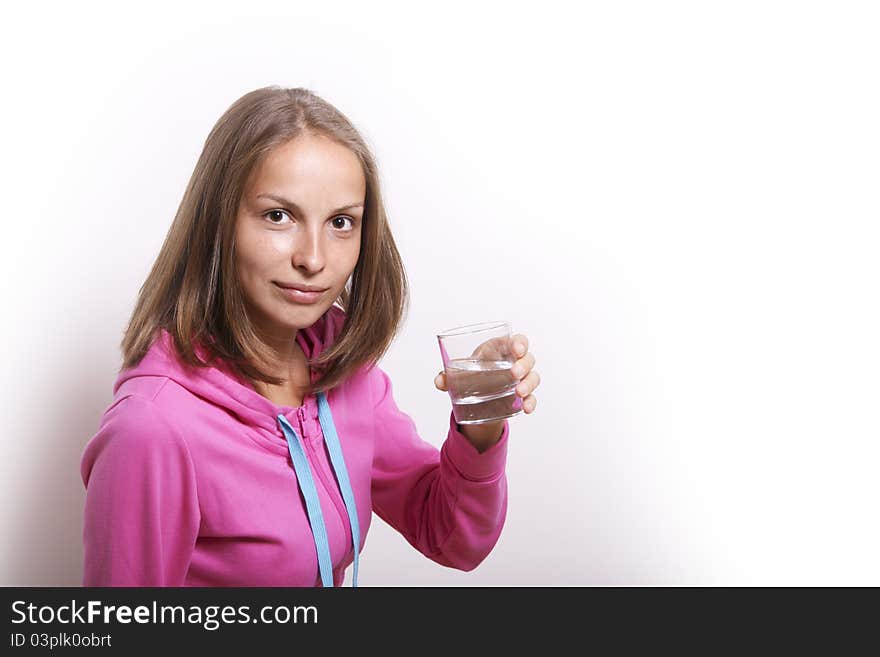 Woman with glass of water on white