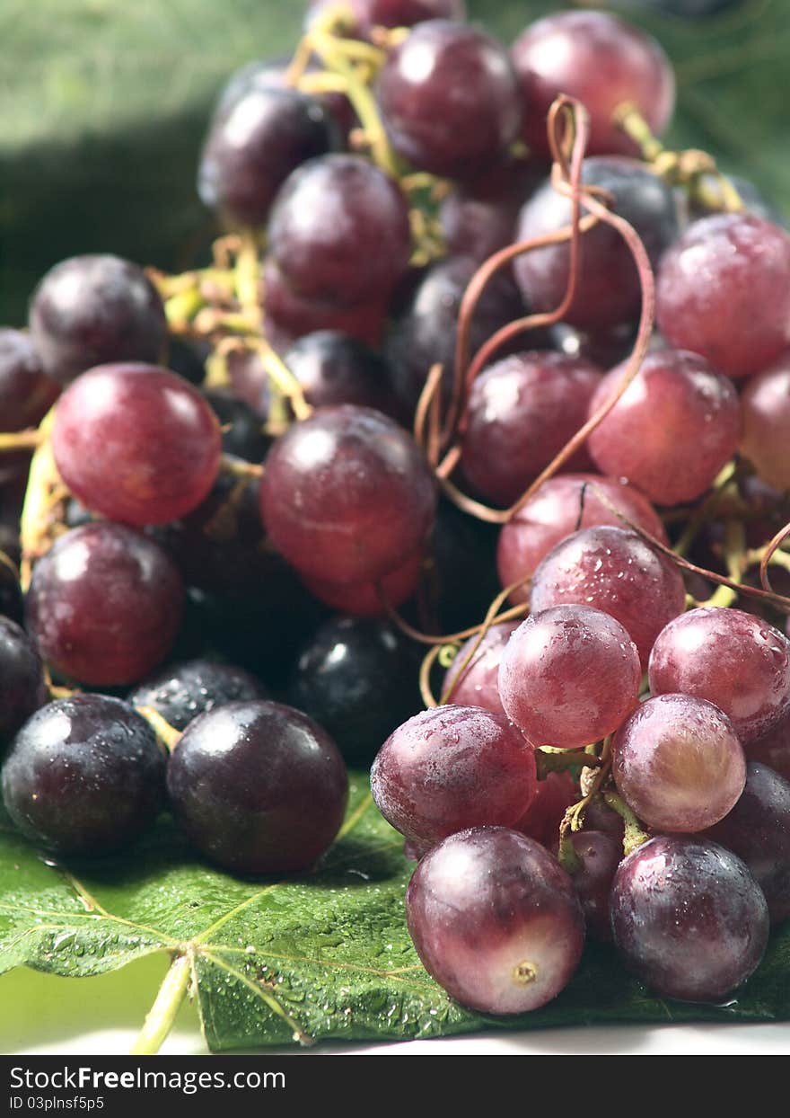 Red Grapes On A Leaf