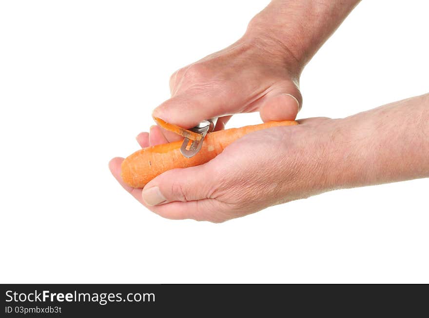 Hands Peeling Carrot