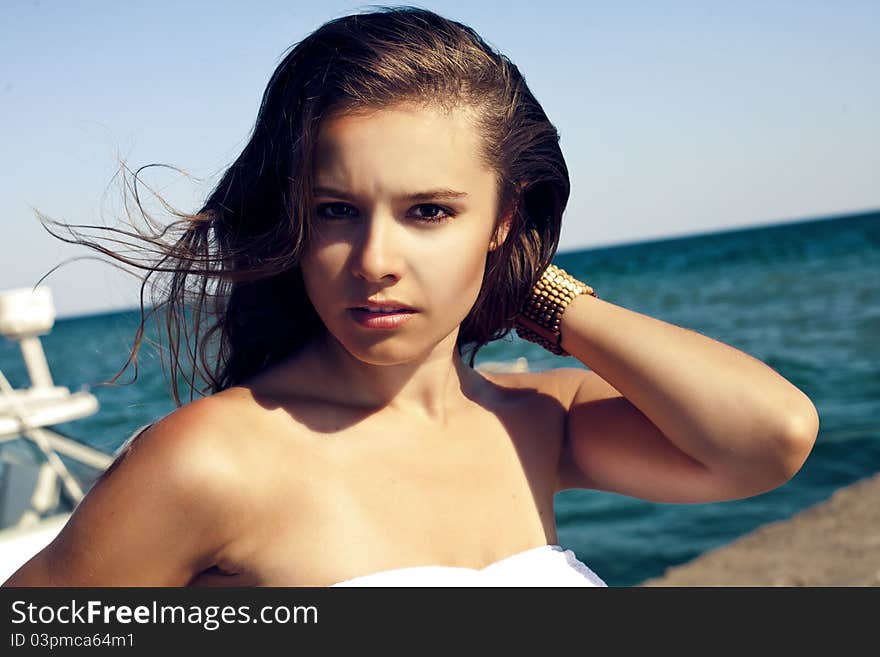 Fashion shot of beautiful woman on the beach