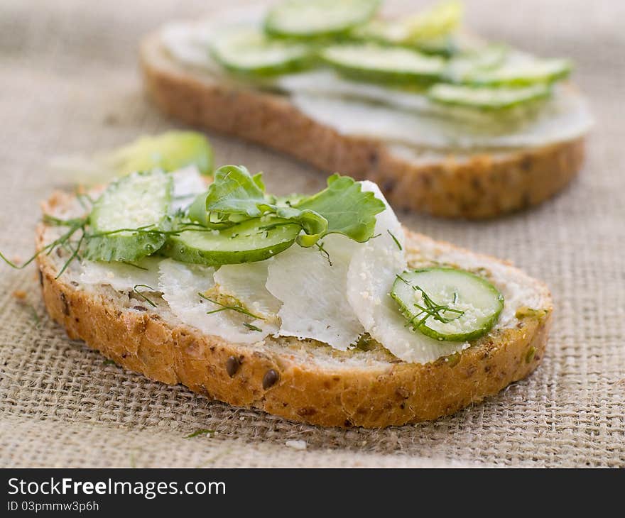 Wholegrain healthy sandwich with cucumber and cabbage. Selective focus